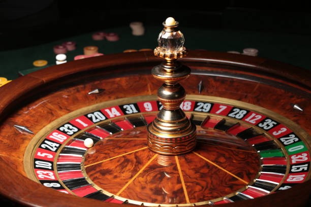 Live roulette spinning wheel with betting board and player options
